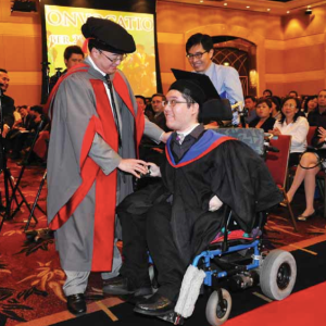Albert Wong graduating from university with a law degree