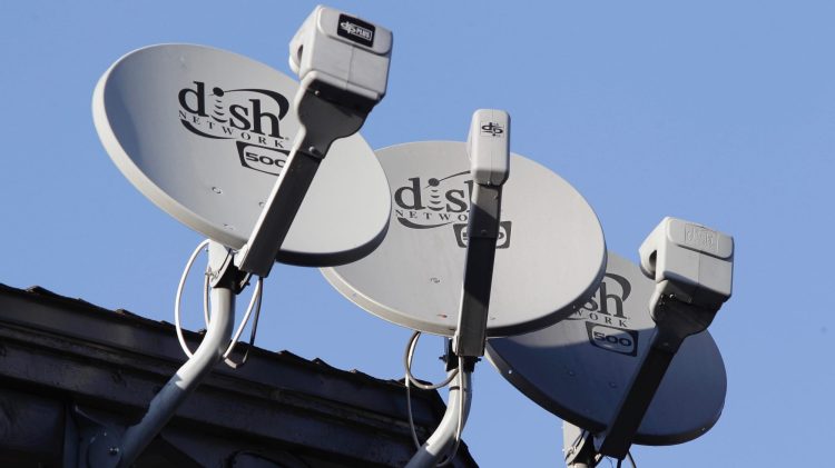 Three Dish Network satellite dishes are shown at an apartment complex in Palo Alto, Calif., Wednesday, Feb. 23, 2011. Dish Network, the nation's third-largest provider of pay-TV service, is reporting that its fourth-quarter net income rose 41 percent to beat Wall Street analysts' expectations, even as it lost subscribers.