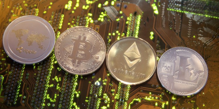 Representations of the Ripple, Bitcoin, Ethereum, and Litecoin cryptocurrencies.