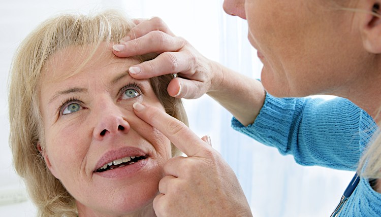 Senior medical check up with focus on eyes examination