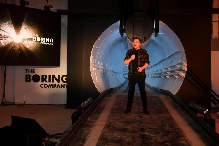 Tesla Inc. founder Elon Musk speaks at the unveiling event by "The Boring Company" for the test tunnel of a proposed underground transportation network across Los Angeles County, in Hawthorne, California, U.S. December 18, 2018.        