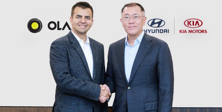 Bhavish Aggarwal, Ola cofounder and CEO, poses with Euisun Chung, Executive Vice Chairman of Hyundai Motor Group.