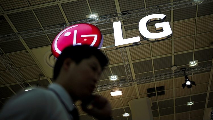 A man talking on his phone walks past the logo of LG Electronics during Korea Electronics Show 2016 in Seoul, South Korea, October 27, 2016.  REUTERS/Kim Hong-Ji/File Photo