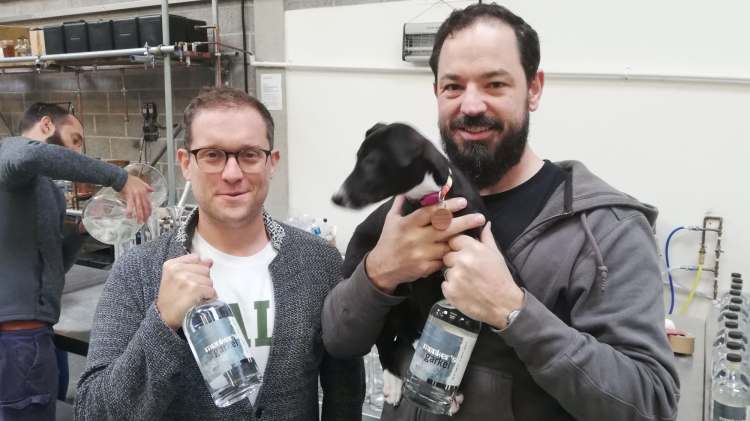 Liam, Danny, and Dizzy the dog from Circumstance Distillery celebrate the launch of the world's first AI gin.
