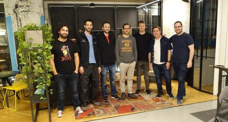Scott Montgomerie (second from right), CEO of Scope AR, with members of WakingApp team.